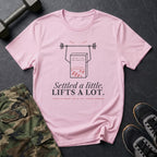 Settled a Little. Lifts a Lot. T-Shirt in Light Pink