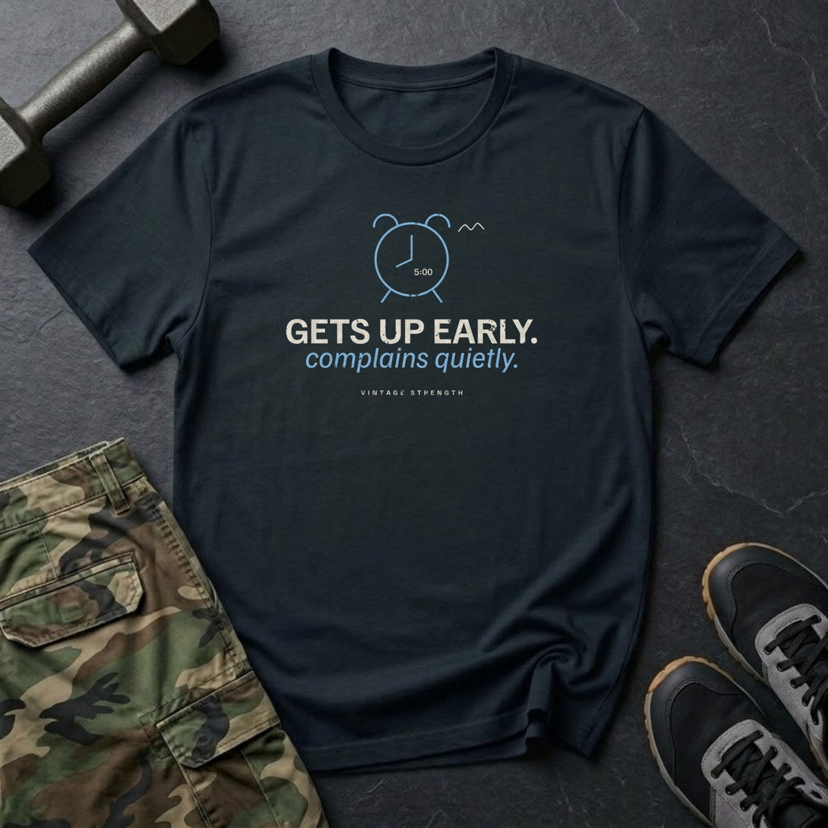 Gets Up Early. Complains Quietly. T-Shirt in Black