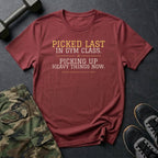 Picked Last in Gym Class. Picking Up Heavy Things Now. T-Shirt in Heather Cardinal